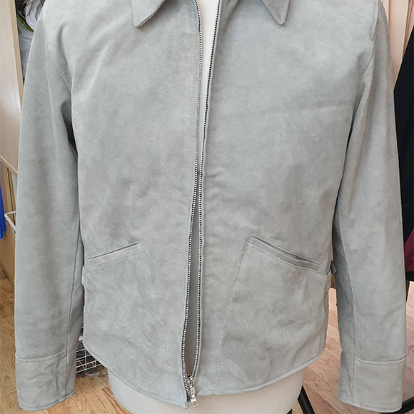 a grey leather jacket on a mannequin